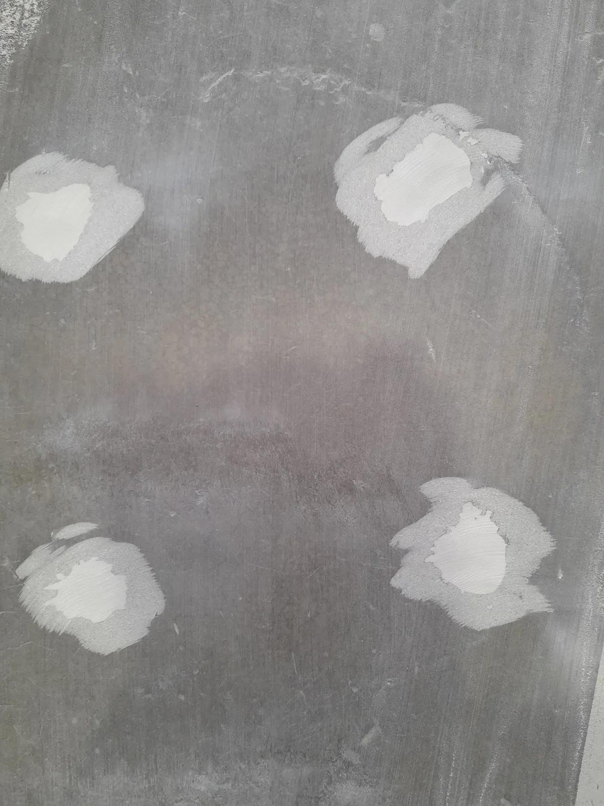 Rack anchor bolt holes filled flush with high-strength epoxy filler after end-of-lease reinstatement — Christchurch
